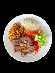 plate of food with rice, beans, salad and meat, healthy food, feijoada, pork rind, pancetta