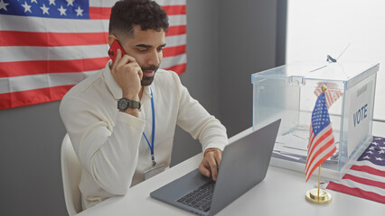 Hispanic man talking on phone by american flag in electoral college with laptop and vote box