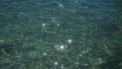 A serene view of the sparkling, clear blue water in porto cesareo, italy, capturing the essence of a tranquil seaside setting in puglia, salento.