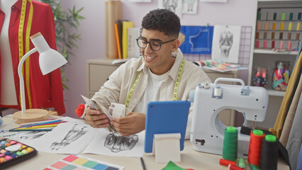 A young man counting egyptian pounds in a vibrant tailor shop filled with sewing supplies and colorful fabrics.