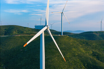 Wind turbines energy generator zero emission Carbone in the green hills, alternative energy sources...