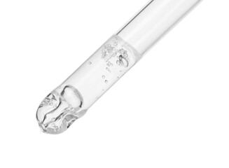 Dripping cosmetic serum from pipette on white background