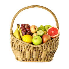 Many different fresh fruits in wicker basket isolated on white