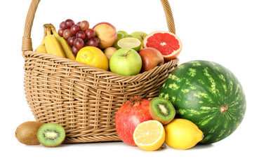 Many different fresh fruits in wicker basket isolated on white