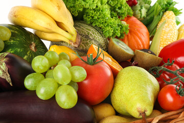 Different fresh fruits and vegetables in basket, closeup