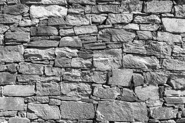 The surface of an old stone wall, perfect for the background. Black and white