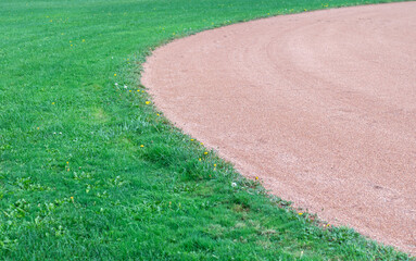 Grass line between the infield and outfield of a softball field