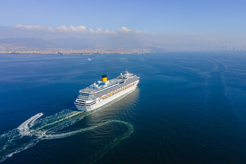Cruise ship sailing across sea, Aerial, white cruise liner in a sunny day. Luxury cruise in the...
