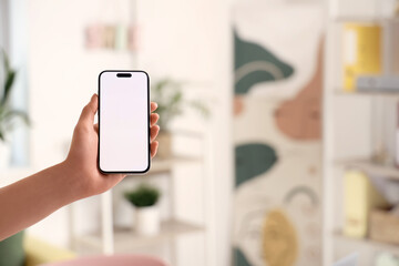 Woman with blank mobile phone in office, closeup