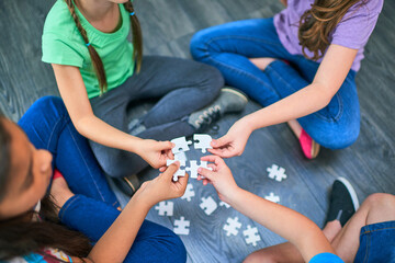 Above, kids and game with puzzle for playing, cognitive development and solution skills by floor....