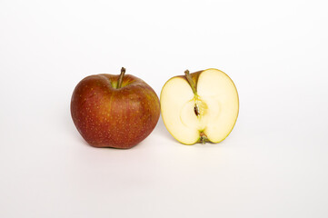 Boskoop apple cut open on white background