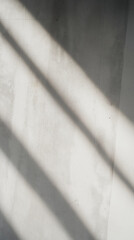 Abstract Sunlight Shadows on Rough Concrete Wall with Textured Surface - Minimalist Architectural Background with Strong Diagonal Lighting and Natural Texture Details, Perfect for Copy Space