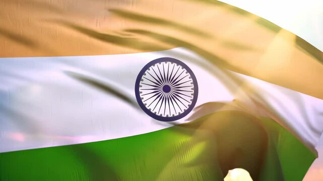 Motion of Indian national flag waving on the sky with beautiful sunlight. Independence Day and Republic day of India. Labour Day. Maharashtra Day. Election in India. Patriotic background. Closeup