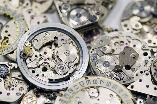 Old mechanical watches with gears and cogs. Watch or clock mechanisms
