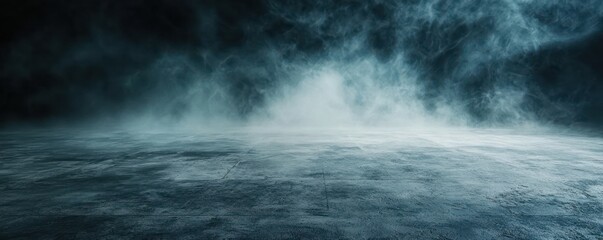 A dark, textured concrete floor covered in mist or fog, creating an abstract and atmospheric background.