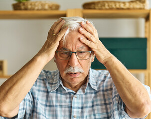 portrait senior man elderly old retirement mature gray hair indoors serious vitality healthy active retired