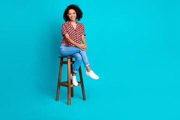 Photo of lovely pretty girl sittingbar chair look isolated cyan color background