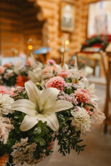 A Bouquet of Lilies and Dahlias Grace the Altar for a Baptism Ceremony