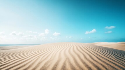 Naklejka premium The vast sand dunes stretch endlessly, their soft curves marked by gentle winds under a bright blue sky, embodying a serene desert landscape