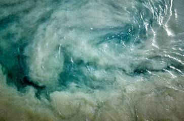 A body of water with a greenish-blue color