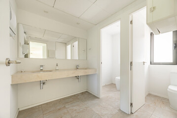 Neutral colors such as white, gray, and beige are used, often combined with materials such as glass, ceramic, and metal 2