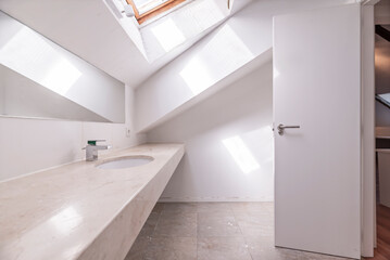 A sense of spaciousness tends to be created through the use of large mirrors, adequate lighting, 2
