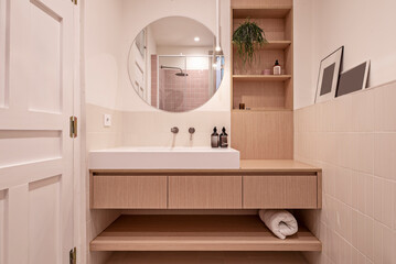 in some cases, the elimination of physical barriers between the bathroom and other areas of the home