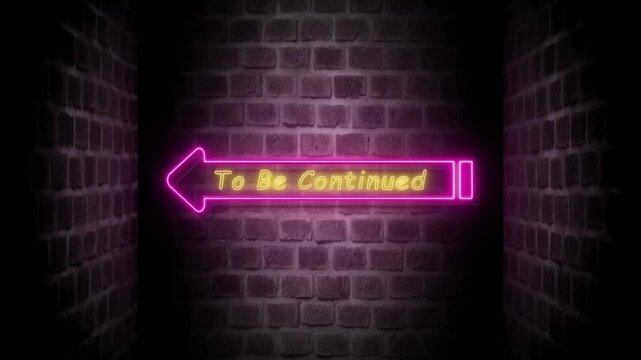 Brick wall with neon arrow sign with text To Be Continued. 4k video