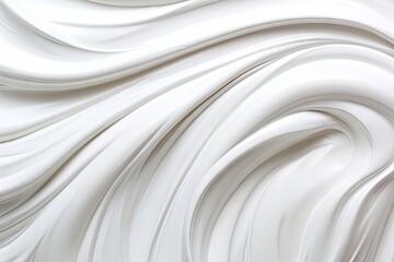 Obraz premium Close-up of smooth white cream texture with soft swirls