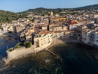 Obraz premium Aerial view on bays, beaches, old colorful houses of famous Saint-Tropez town on French Riviera, Var, Provence, France, summer vacation destination