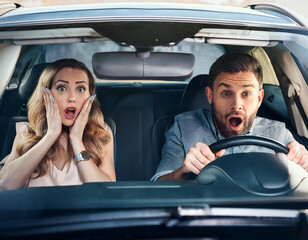 frightened passengers in the car during an road accident. Nervous lady and male driver with worried expression afraid to drive car by herself for first time or having car accident on road.