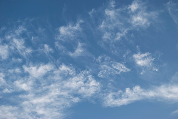 gentle white clouds in the blue sky