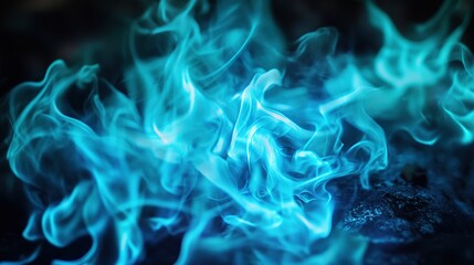 Fototapeta premium Ethereal blue flames swirling in darkness.