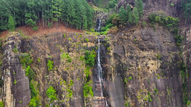 Beautiful waterfall in the rainforest. Bambarakanda Falls in the tropical mountain jungle. Sri Lanka.