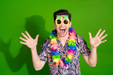 Photo of positive funny guy with bristle dressed print shirt in sunglass necklace raising palms up...