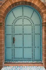 Traditional house, decorative blue door, in historic Medina, Essaouira, Morroco, travel