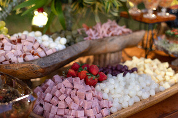 table with food breads, fruits cheeses party decoration healthy foods