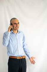 Young office worker dress up arguing on his smart phone. Businessman speaking on his phone.