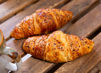 Appetizing fresh crispy croissant served for dessert
