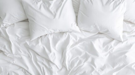 Obraz premium White Bedding Wrinkled Sheets and Pillows Cozy Bedroom Top View