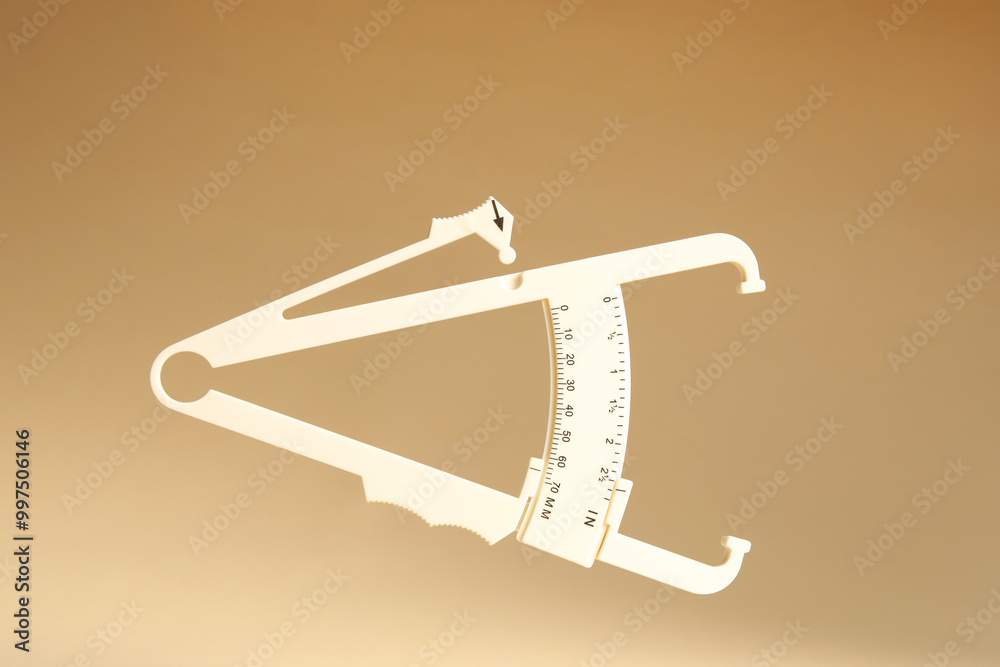 Canvas Prints Plastic body fat caliper on beige background