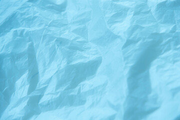 Texture of crumpled blue paper. Abstract background for design.
