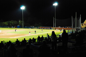 Folks cheer on their favorite collegiate players at a night game in the Cape Cod Baseball League
