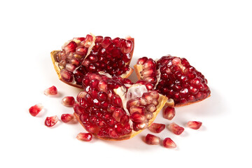 open pomegranates, and pomegranate seeds isolated on white background.