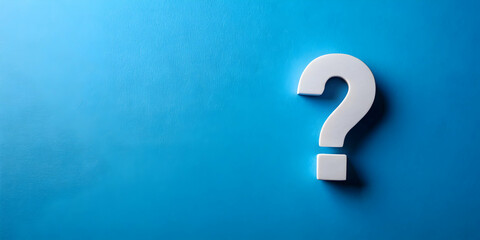 Minimalist stock photo of a question mark symbol on cutout paper against a blue background, FAQ, information, problem