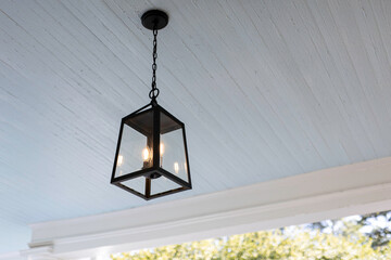 Modern Black Pendant Light Fixture On Blue Ceiling