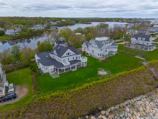 Historic coastal mansion aerial view in a cloudy at the coast of Hull near Cohasset, Massachusetts MA, USA. 