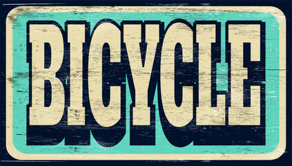 Aged and worn bicycle sign on wood