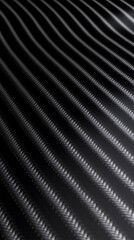 A close-up image of black carbon fiber, showcasing its distinctive woven pattern. 