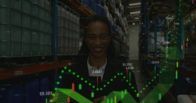 Animation of financial data processing over african american businesswoman in warehouse - Powered by Adobe